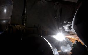 welder welding aluminum with a tig machine